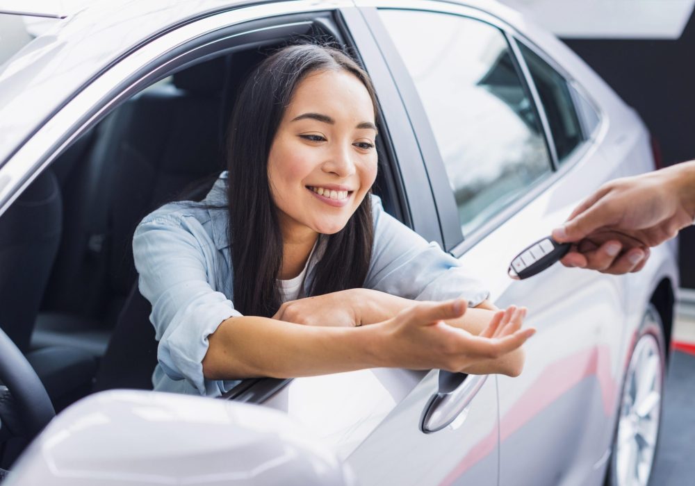 happy-woman-car-dealership-min